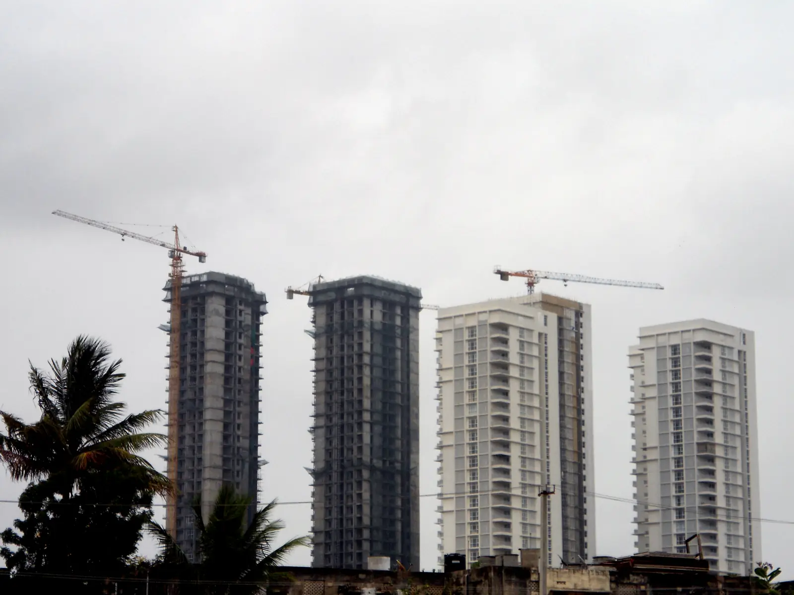 Apartment towers under construction, with tower cranes, in Kukatpally, Hyderabad